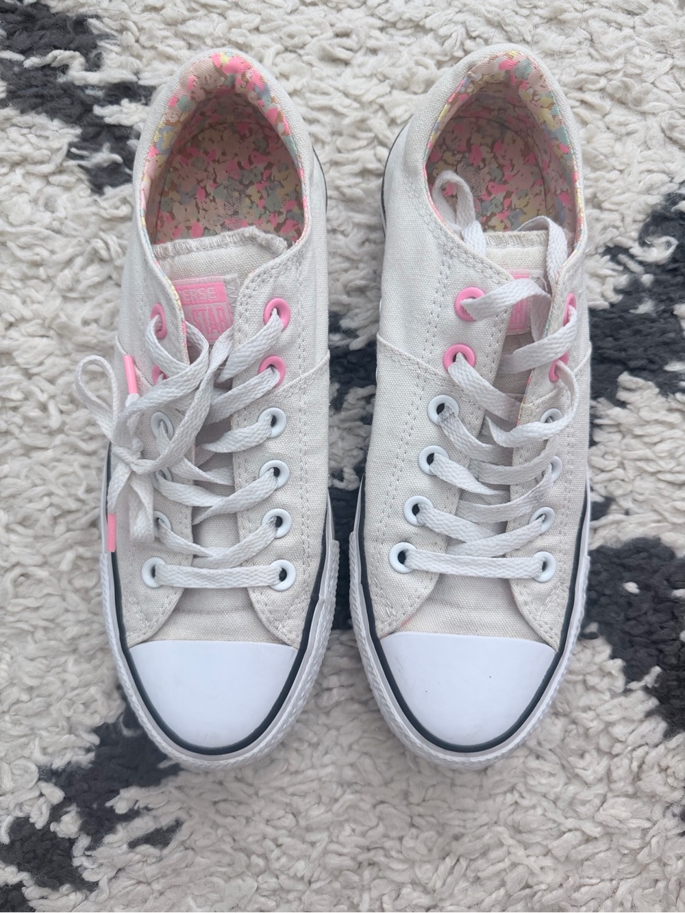 Converse All-Stars Women’s White Canvas Sneakers with Pink Accents